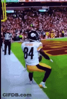 Football Player Number 84 Kneeling On Field GIF