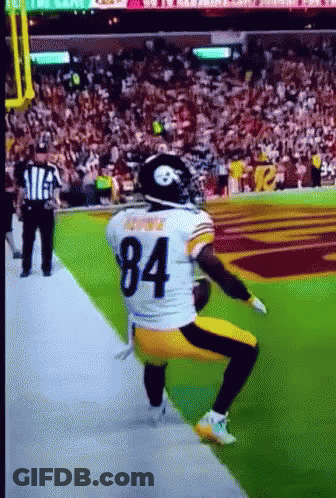 Football Player Number 84 Squatting On Field GIF