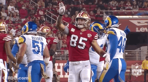 Football Player Number 85 Congratulated By Teammates GIF
