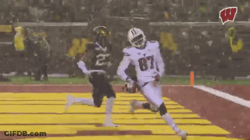 Football Player Number 87 Running Toward Player GIF