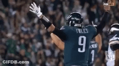 Football Player Number 9 Arms Outstretched GIF