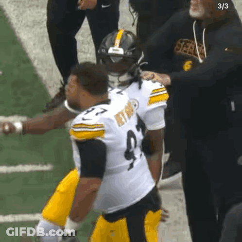 Football Player Number 9 Helped Off Field GIF