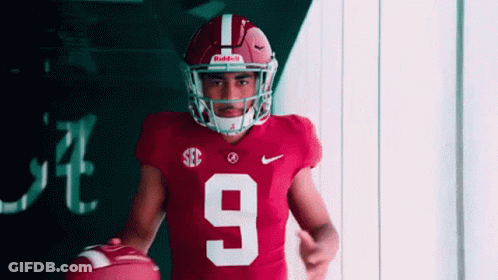 Football Player Number 9 Holding Football GIF