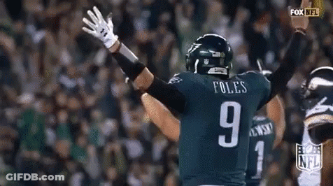 Football Player Number 9 Raising Arms GIF
