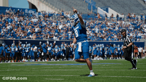 Football Player Number 9 Standing On Field GIF