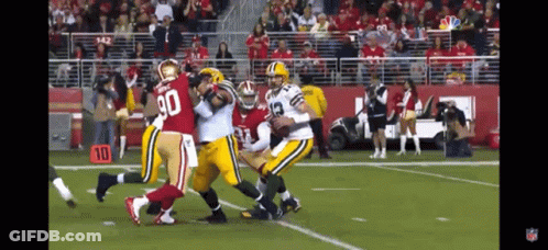 Football Player Number 90 Being Tackled GIF