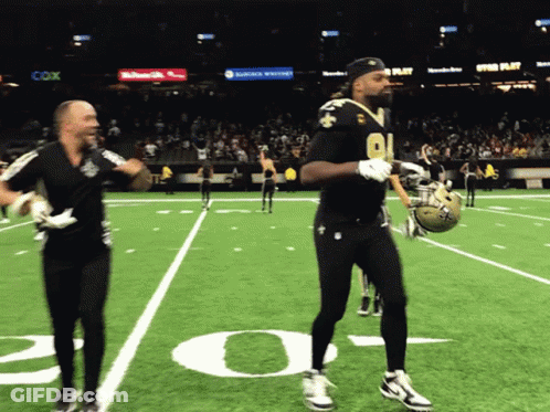 Football Player Number 91 Walks Off Field GIF