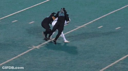 Football Player Number 94 Being Tackled GIF