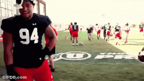 Football Player Number 94 On Field GIF