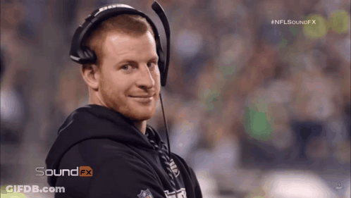 Football Player Number 95 Helmet Stands In Front Of Camera GIF