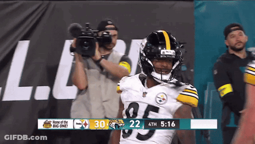 Football Player Number 95 In Front Of Camera GIF