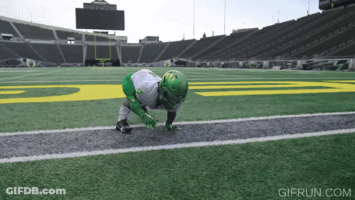 Football Player On Field With Gifrun Logo GIF
