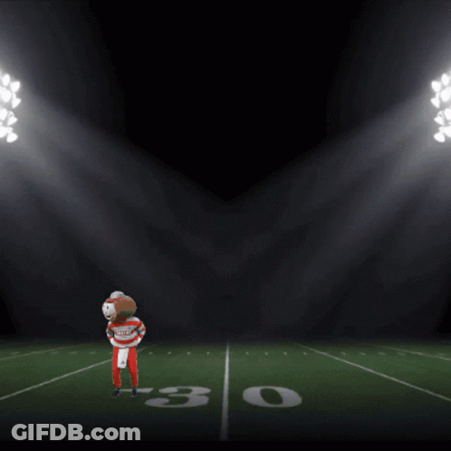 Football Player On Field With It's Game Time Scoreboard GIF