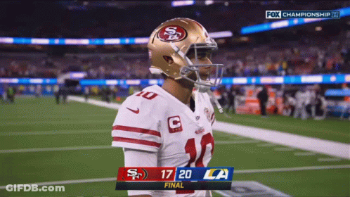 Football Player On Field With Scoreboard 17 20 LA GIF