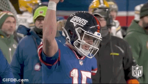 Football Player Raising Arm With Giants Helmet GIF