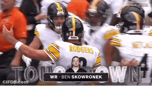 Football Player Rodgers Surrounded By Players GIF