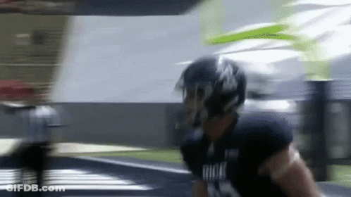 Football Player Running In Helmet And Gloves GIF