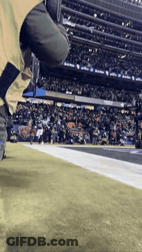 Football Player Running In Purple Jersey And Helmet GIF