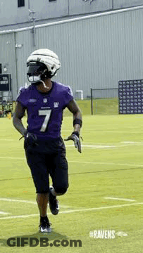 Football Player Running In Purple Jersey And Helmet GIF