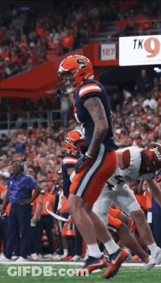Football Player Running On Field GIF