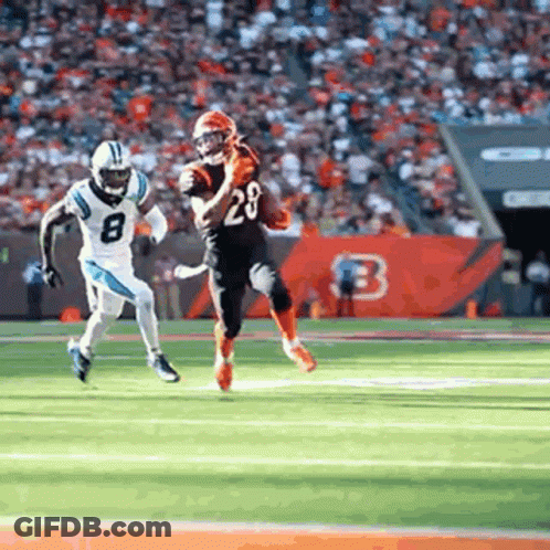 Football Player Running With Ball Being Chased GIF