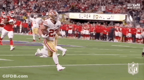 Football Player Running With Ball During Super Bowl GIF