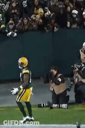 Football Player Running With Cameraman GIF