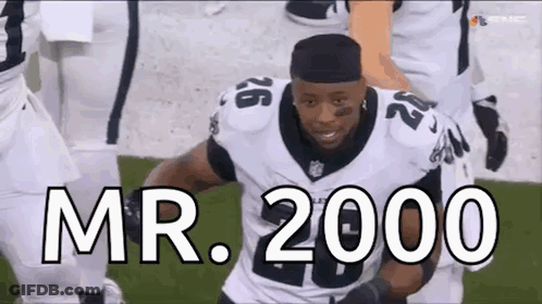 Football Player Running With Mr. 2000 GIF