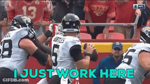 Football Player Saying I Just Work Here Holding Ball GIF
