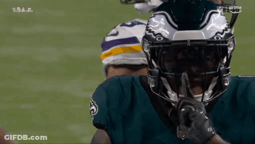 Football Player Shushing With Finger To Mouth GIF