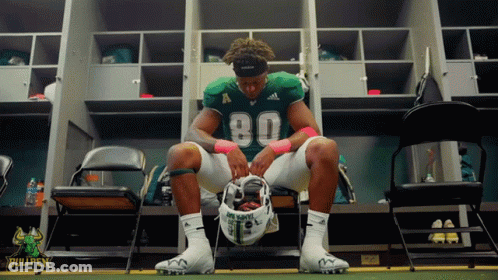 Football Player Sits In Locker Room Number 80 GIF