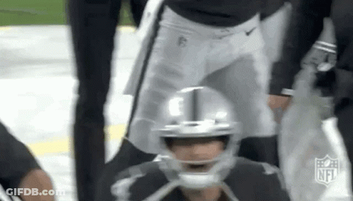 Football Player Sitting On Field During Game GIF