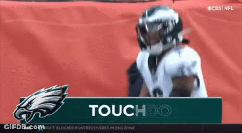 Football Player Standing In Front Of Touchdo Sign GIF
