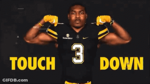 Football Player Standing In Front Of Tough Down Sign GIF
