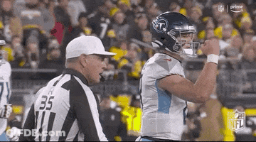 Football Player Standing Next To Referee GIF