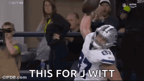 Football Player Tackled By Fan Holding Football GIF