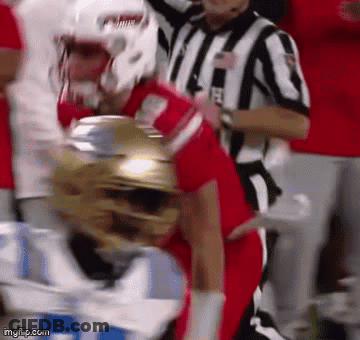 Football Player Tackled With Referee Watching GIF