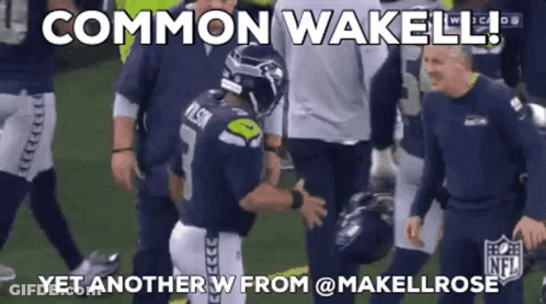 Football Player Talking To Another On Field GIF