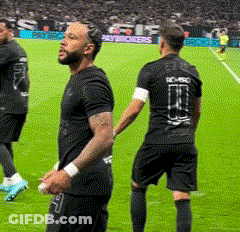 Football Player Trying To Catch Ball While Being Tackled GIF
