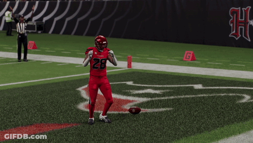 Football Player Tying Shoes On Field GIF