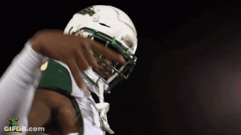 Football Player Wearing Bullpen Helmet GIF