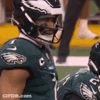 Football Player Wearing Helmet And Mask GIF