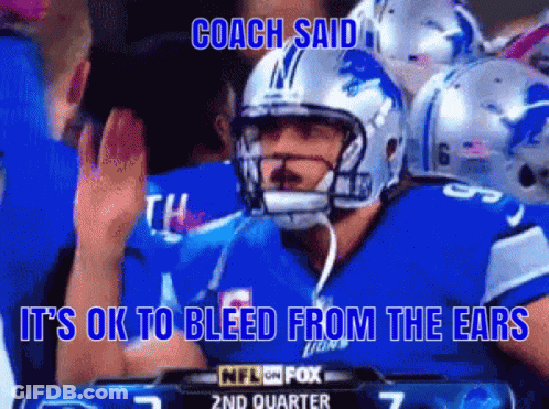 Football Player Wearing Helmet With Coach GIF