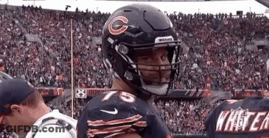 Football Player Wearing Helmet With G GIF
