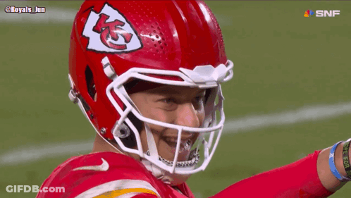 Football Player Wearing Red Helmet With KC Logo GIF