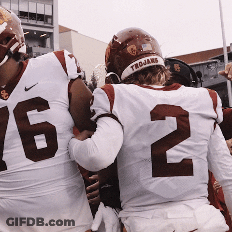 Football Player Wearing Trojans Helmet GIF