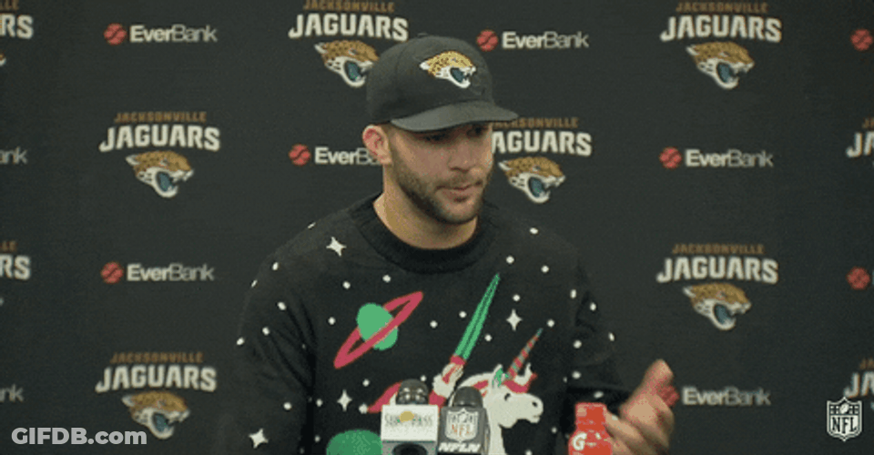 Football Player Wearing Ugly Sweater GIF