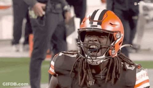 Football Player With Dreadlocks In Helmet GIF