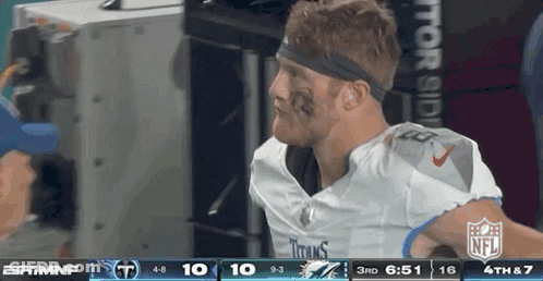 Football Player With Headband In Front Of NFL Scoreboard GIF
