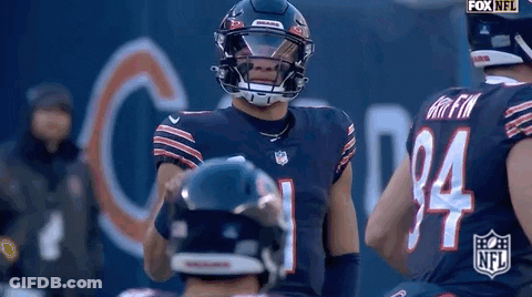 Football Player With Helmet Standing Next To Player GIF